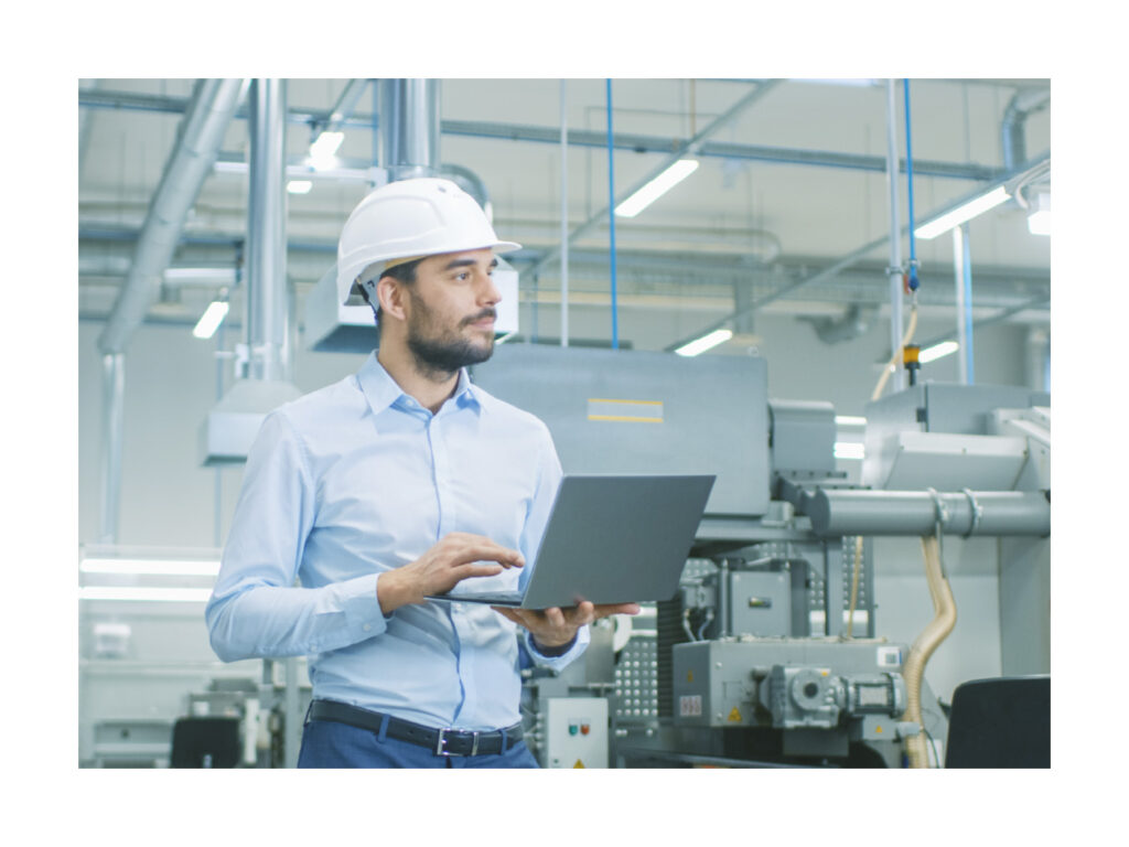Smart factory worker with laptop